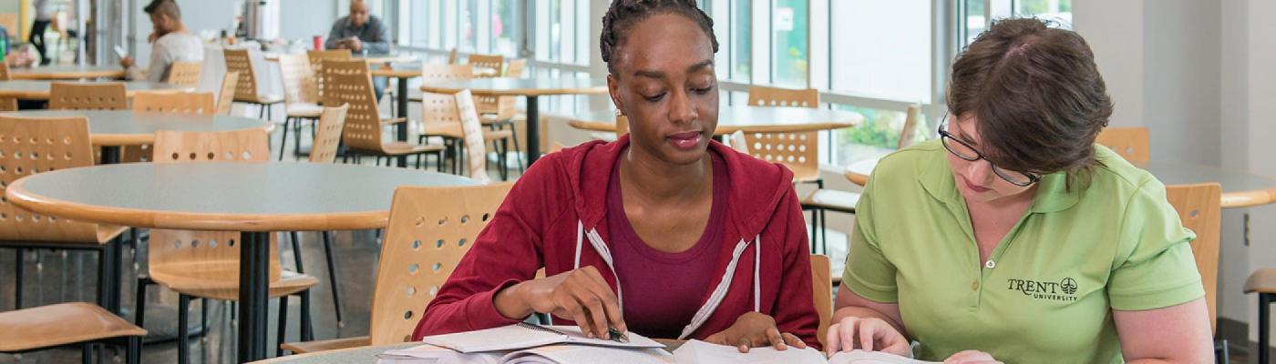 A student tutoring another student