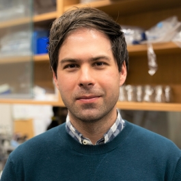 Robert Huber smiling and standing in his lab